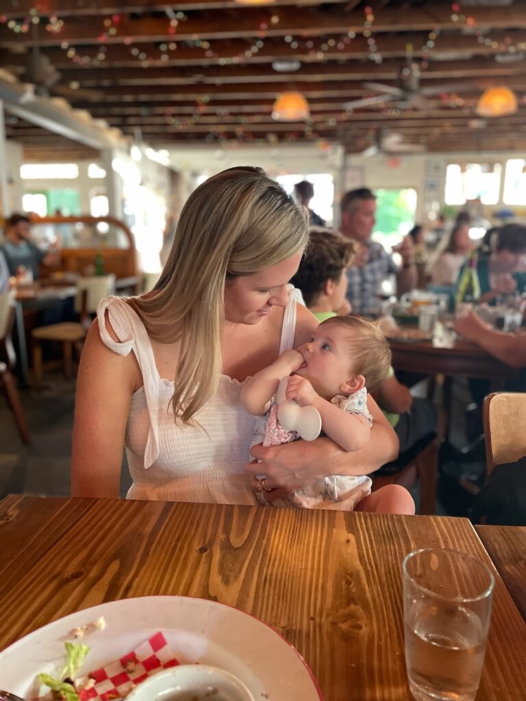 Lindsey and baby dining at Leon's Oyster Shop in Charleston.