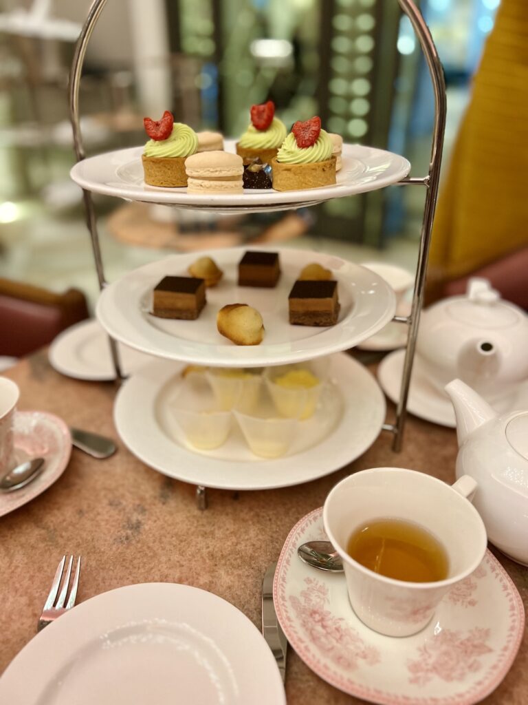 tea service at Camellias at hotel bennett with tea cups and tray of sweets